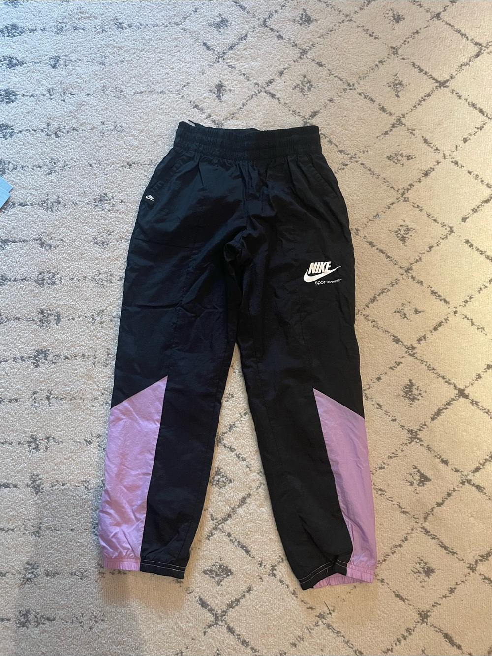 Nike Kids Black and Lavender Colorblock Track Pants.